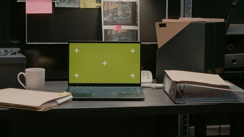 Greenscreen display on portable laptop in incident room